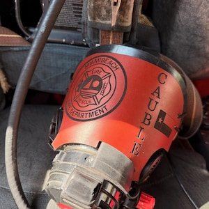 Etsy buyer photo of a personalized 737Leather firefighter mask cover